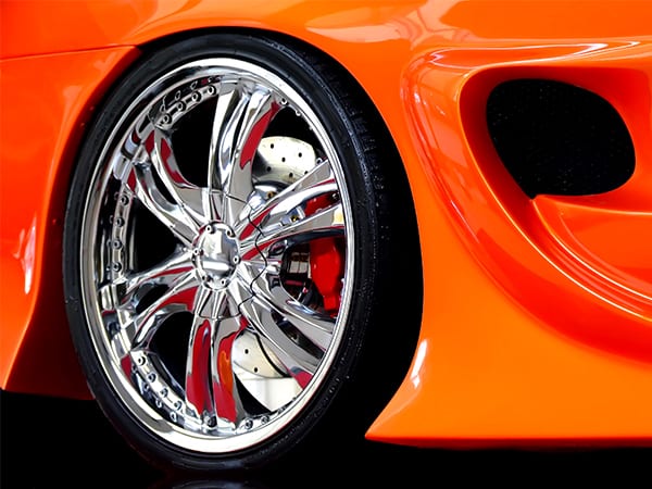 Custom chrome wheel for a sports car.