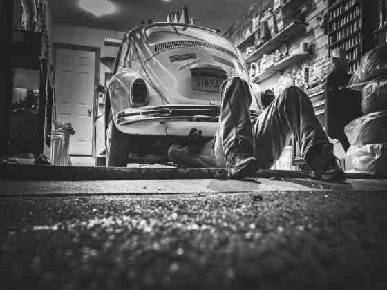 man working on an older volkswagen