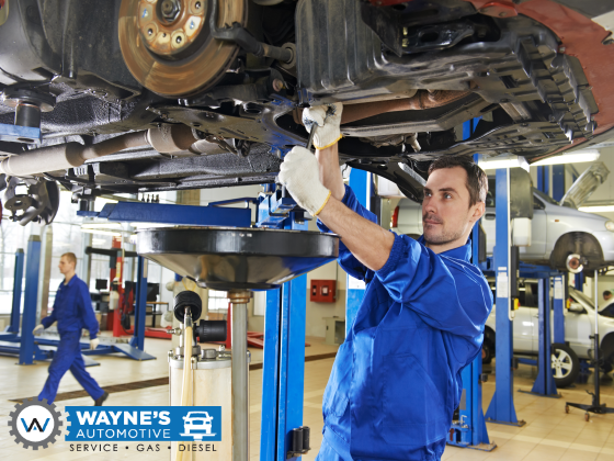 Service Technician Working On Car At Wayne's Automotive Center